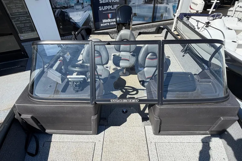 Slide: The Image of 2022 Tracker Pro Guide V-175 WT boat interior with seating and steering console. - 13