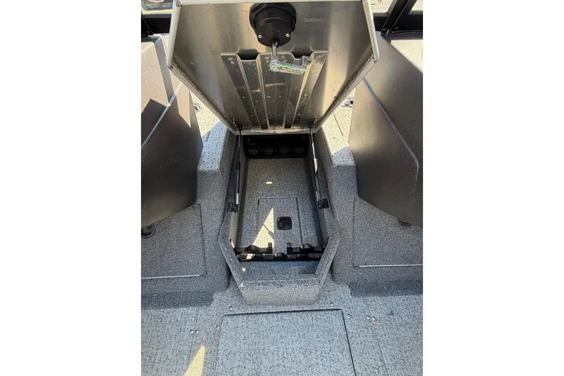 Slide: The Image of Open storage compartment in 2022 Tracker Pro Guide V-175 WT boat interior. - 15