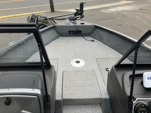 Slide: The Image of 2022 Tracker Pro Guide V-175 WT boat interior with carpeted deck and windshield. - 6