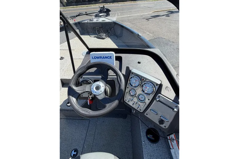 Slide: The Image of 2022 Tracker Pro Guide V-175 WT boat dashboard with steering wheel and gauges. - 8