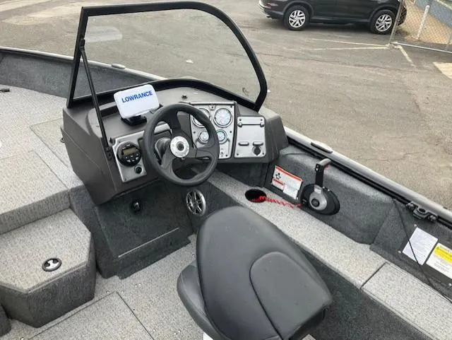 Slide: The Image of 2022 Tracker Pro Guide V-175 WT boat interior with steering wheel and Lowrance display. - 9