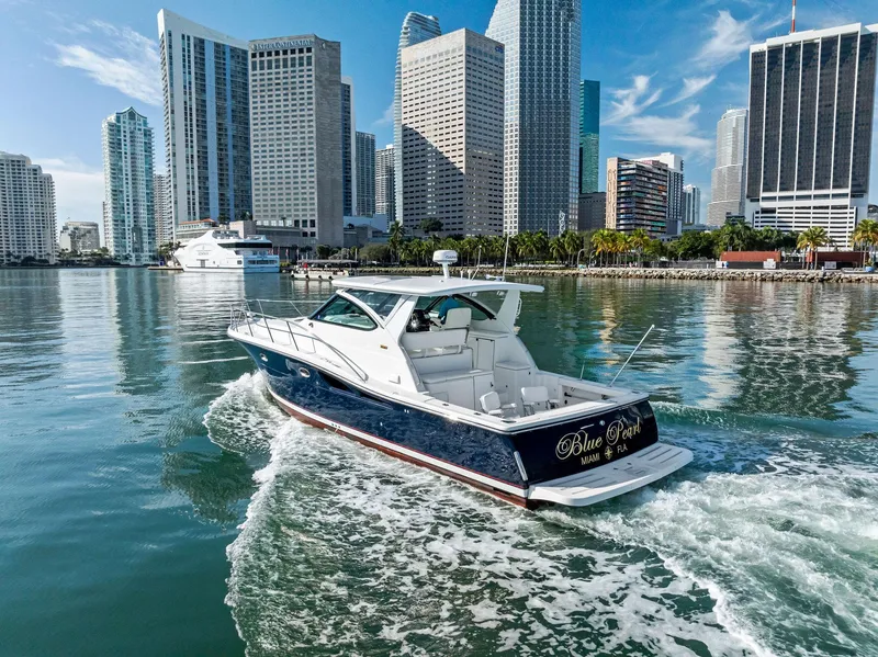 Slide: The Image of Tiara Yachts 4200 Open 2004 cruising in urban waterfront setting. - 14