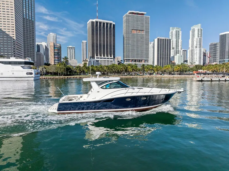 Slide: The Image of 2004 Tiara Yachts 4200 Open cruising in urban waterfront setting. - 19