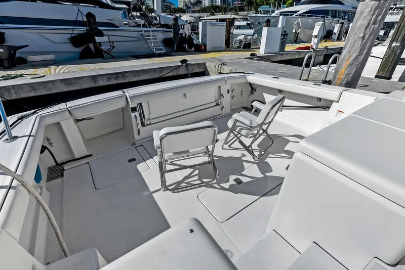 Slide: The Image of 2004 Tiara Yachts 4200 Open cockpit with seating, docked at marina. - 20