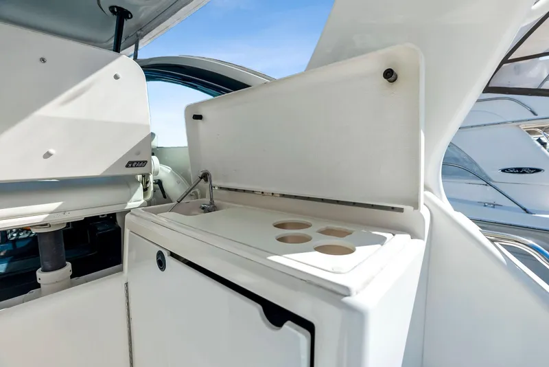 Slide: The Image of Tiara Yachts 4200 Open 2004 model, featuring a sleek onboard kitchenette. - 29