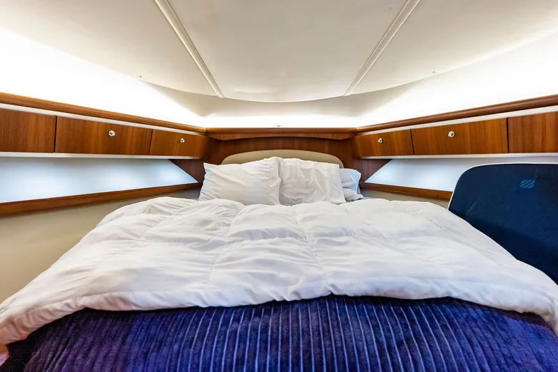 Slide: The Image of Luxurious cabin interior of 2004 Tiara Yachts 4200 Open with cozy bedding. - 41