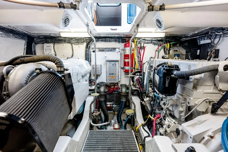 Slide: The Image of Engine room of 2004 Tiara Yachts 4200 Open, showcasing mechanical components and wiring. - 45