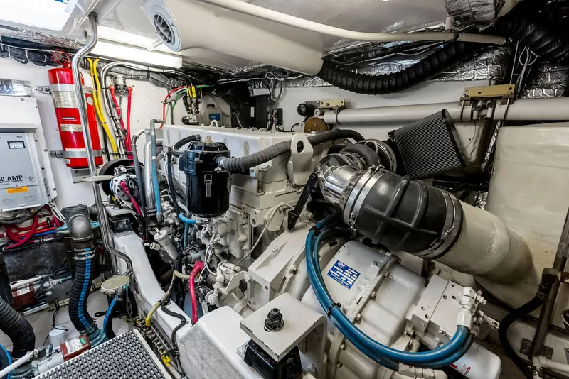Slide: The Image of Engine room of 2004 Tiara Yachts 4200 Open, showcasing complex machinery and wiring. - 47