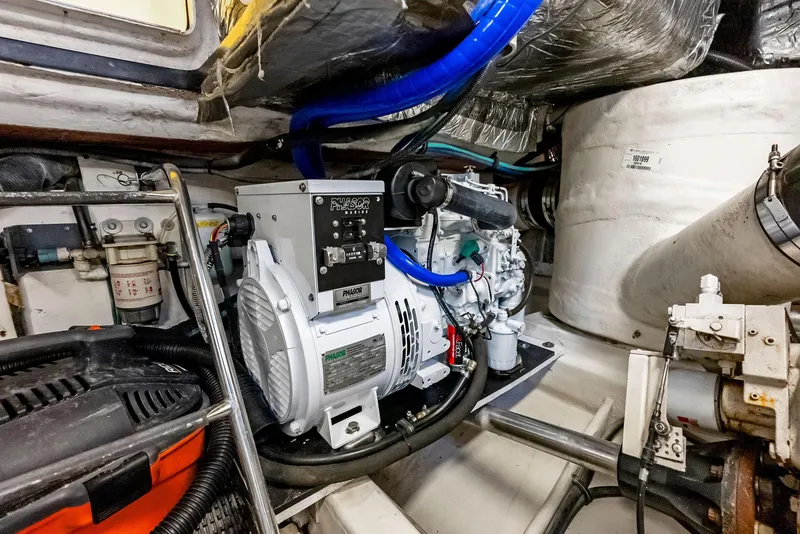 Slide: The Image of Engine room of 2004 Tiara Yachts 4200 Open, showcasing mechanical components and equipment. - 48