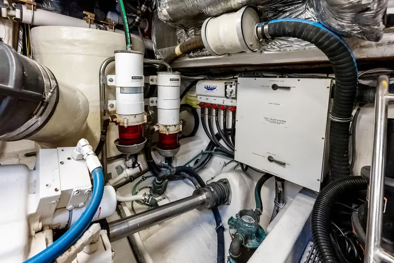 Slide: The Image of Engine room of 2004 Tiara Yachts 4200 Open, showcasing mechanical components and systems. - 49