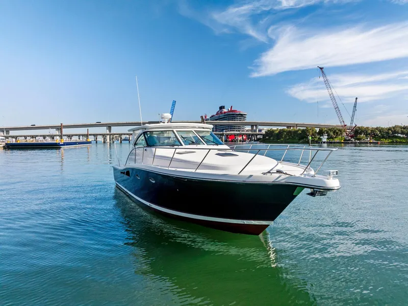 Slide: The Image of 2004 Tiara Yachts 4200 Open cruising in a sunny harbor. - 5