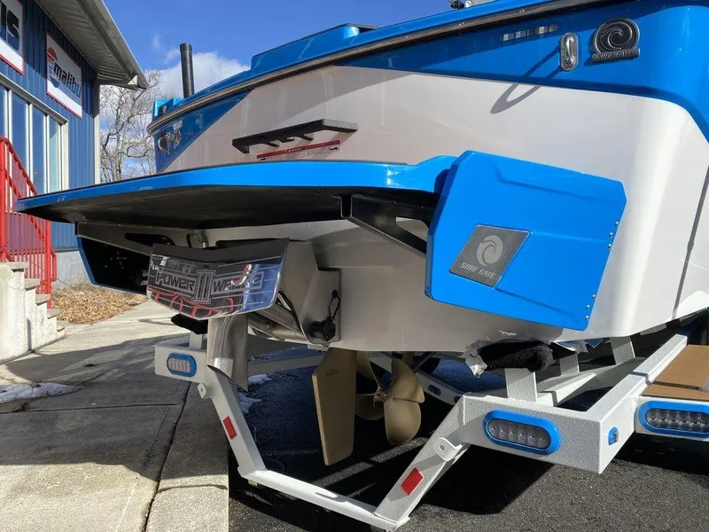 Slide: The Image of 2025 Axis T235 boat on trailer, showcasing rear design and propeller system. - 4