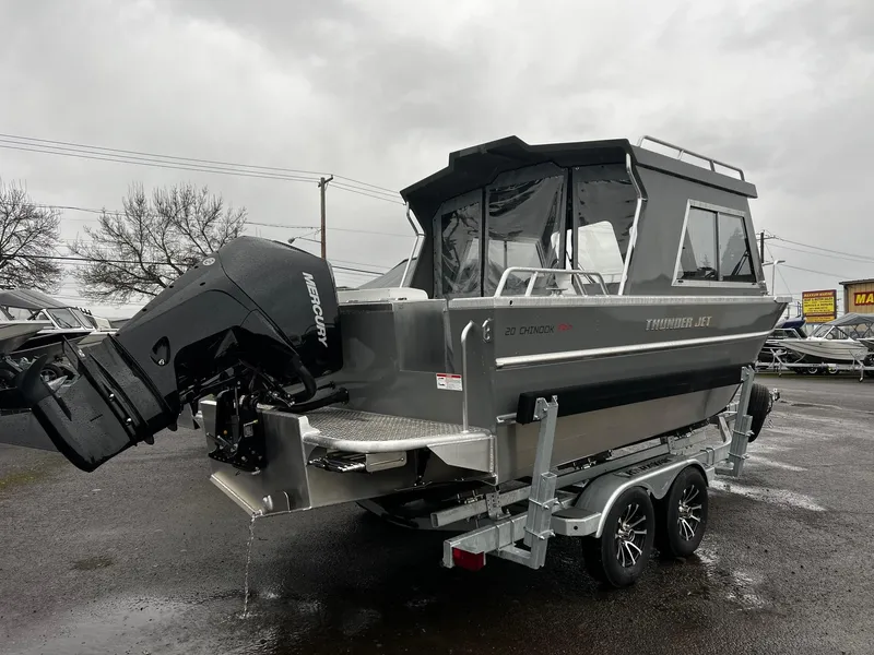 Slide: The Image of 2024 Thunder Jet 20 Chinook Pro boat on trailer, featuring a powerful outboard motor. - 2