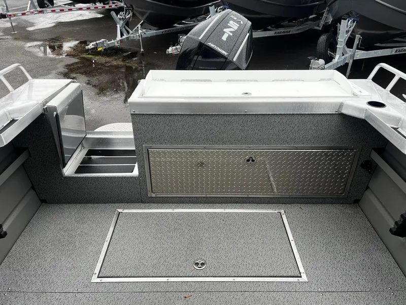 Slide: The Image of 2024 Thunder Jet 20 Chinook Pro boat interior with storage compartments and non-slip flooring. - 4