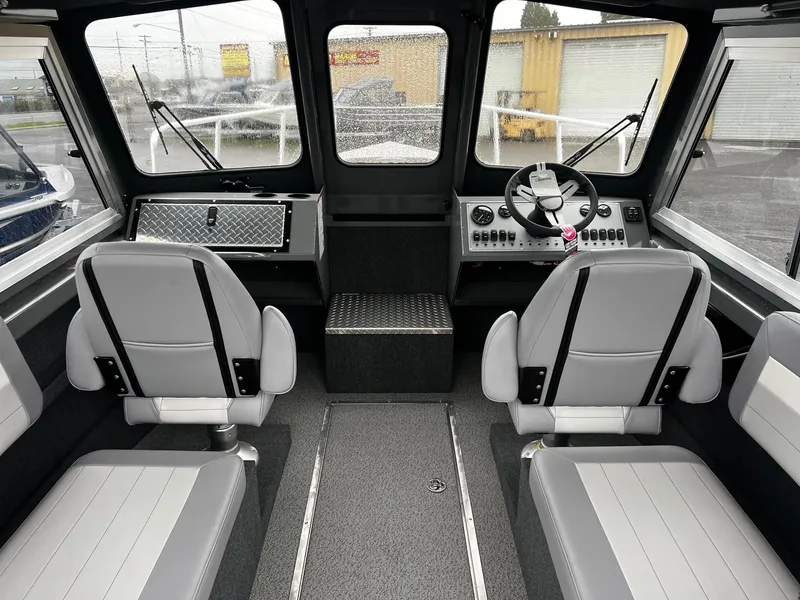 Slide: The Image of 2024 Thunder Jet 20 Chinook Pro boat interior with modern seating and dashboard. - 5