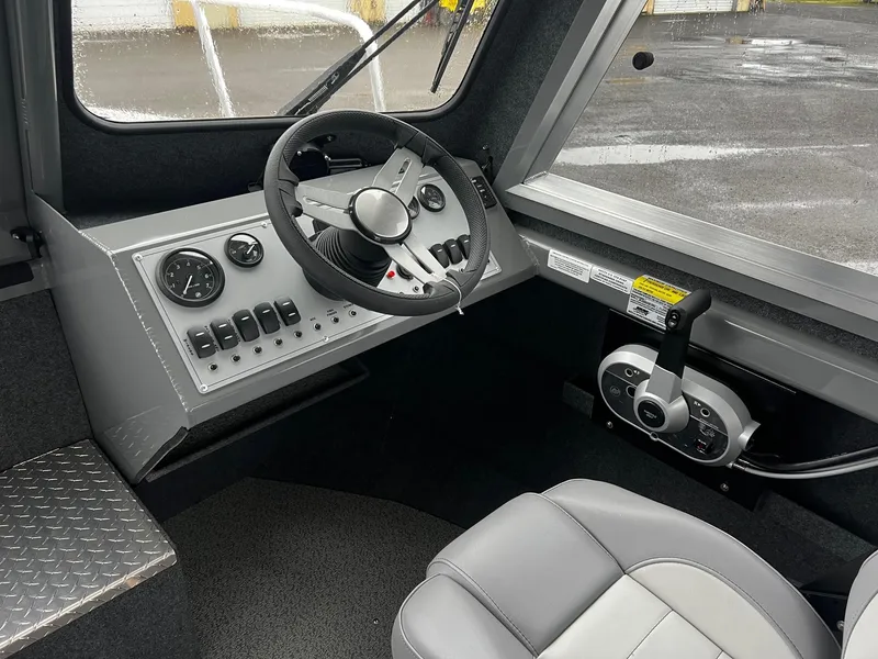 Slide: The Image of 2024 Thunder Jet 20 Chinook Pro boat interior with steering wheel and control panel. - 6