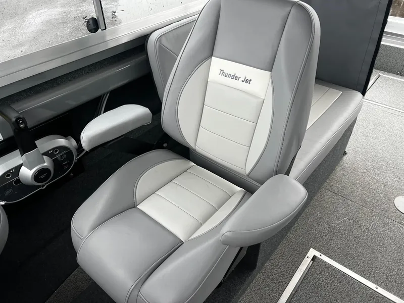 Slide: The Image of 2024 Thunder Jet 20 Chinook Pro boat interior with gray and white seating. - 8