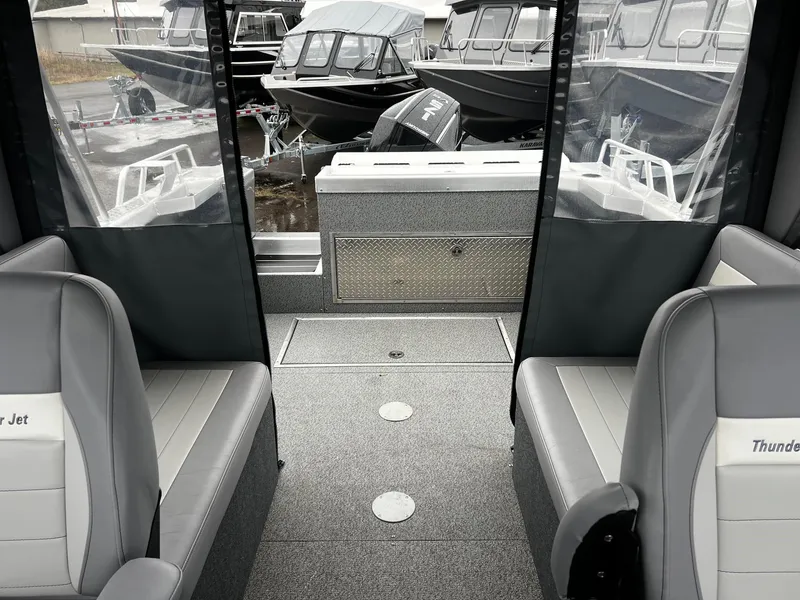 Slide: The Image of Interior of 2024 Thunder Jet 20 Chinook Pro boat with seating and storage. - 9