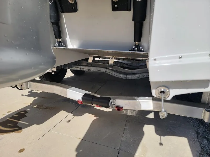 Slide: The Image of Close-up of 2025 Shallow Sport 24 Modified V boat trailer suspension system. - 17