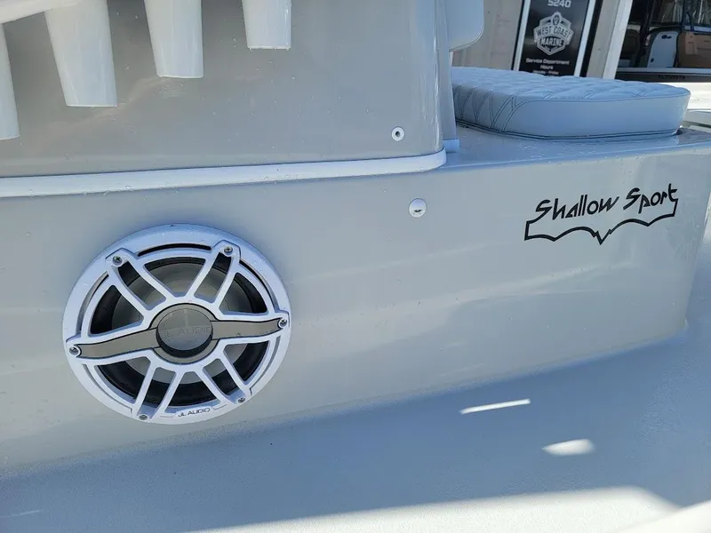 Slide: The Image of 2025 Shallow Sport 24 Modified V boat with speaker and logo detail. - 18