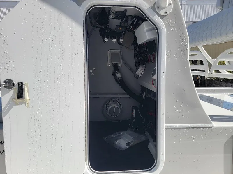 Slide: The Image of Interior view of 2025 Shallow Sport 24 Modified V boat cabin. - 25