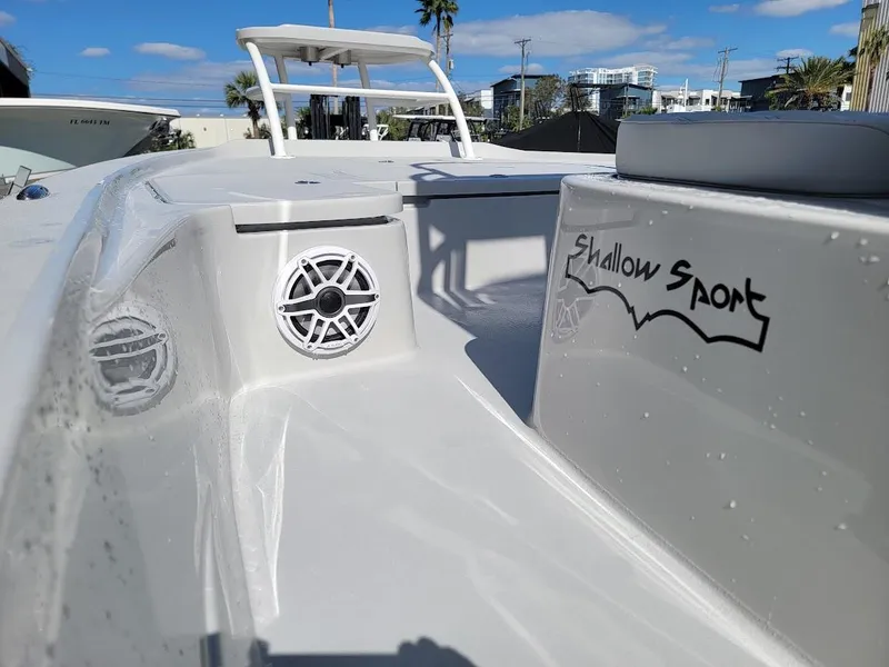 Slide: The Image of 2025 Shallow Sport 24 Modified V boat with sleek design and speaker system. - 27