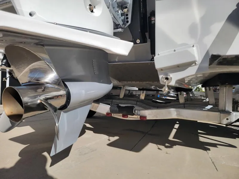 Slide: The Image of Close-up of 2025 Shallow Sport 24 Modified V boat propeller and trailer. - 5