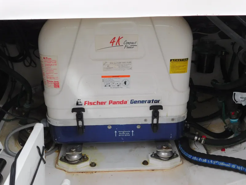 Slide: The Image of Fischer Panda generator in 2018 Pursuit OS 325 Offshore boat engine compartment. - 30