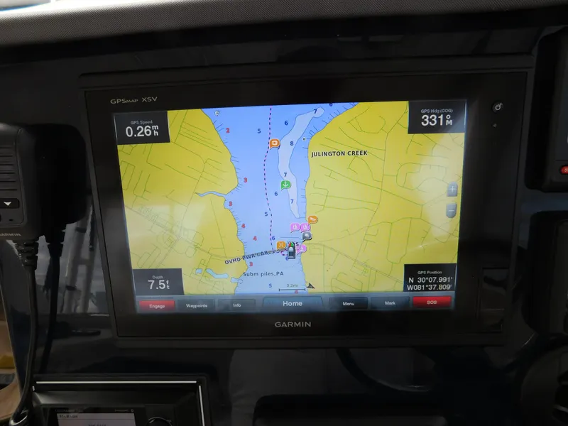Slide: The Image of Garmin GPS display on 2018 Pursuit OS 325 Offshore, showing navigation map and coordinates. - 48