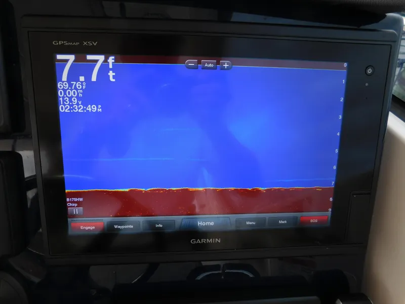 Slide: The Image of Garmin GPS display on 2018 Pursuit OS 325 Offshore boat showing depth and temperature. - 49