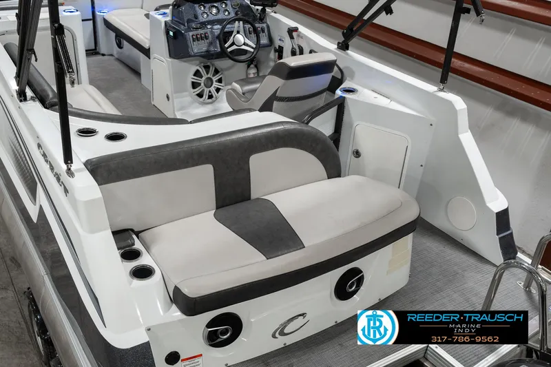 Slide: The Image of 2019 Crest Calypso 190 boat interior with seating and steering console. - 12
