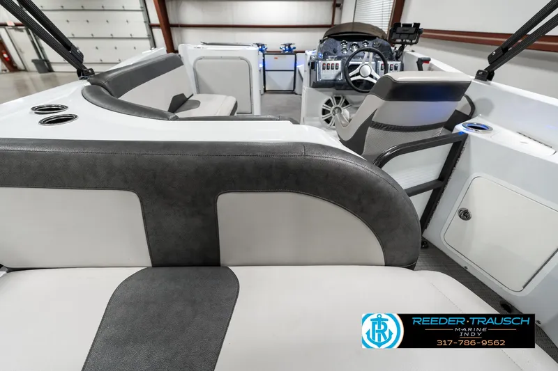 Slide: The Image of 2019 Crest Calypso 190 boat interior with modern seating and steering console. - 16