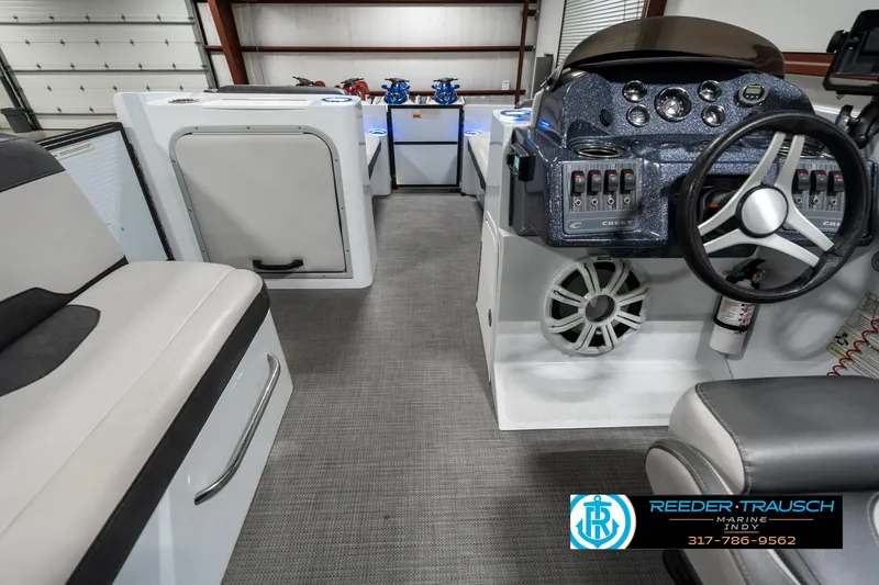 Slide: The Image of Interior of 2019 Crest Calypso 190 boat with modern dashboard and seating. - 17