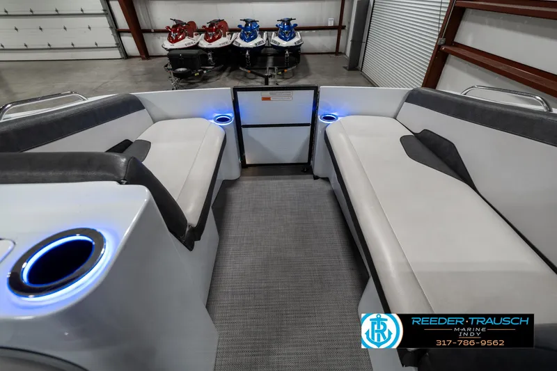 Slide: The Image of 2019 Crest Calypso 190 boat interior with LED cup holders and seating. - 18