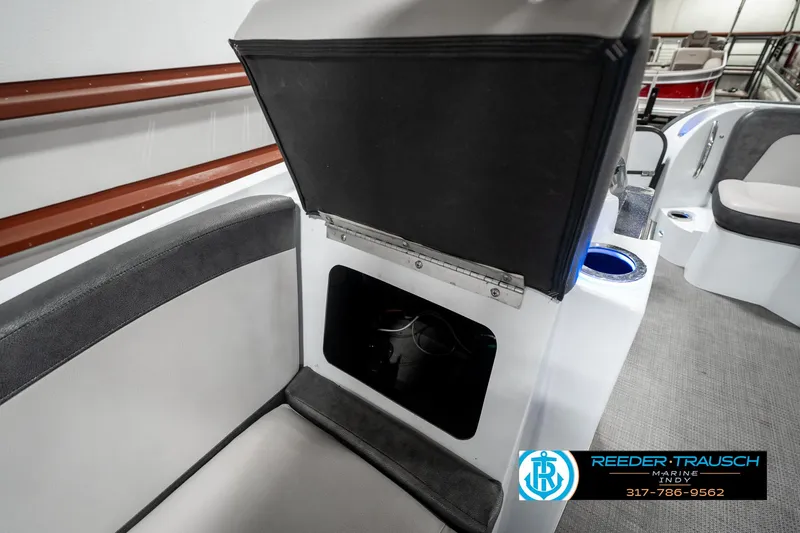 Slide: The Image of 2019 Crest Calypso 190 boat interior with open storage compartment. - 24