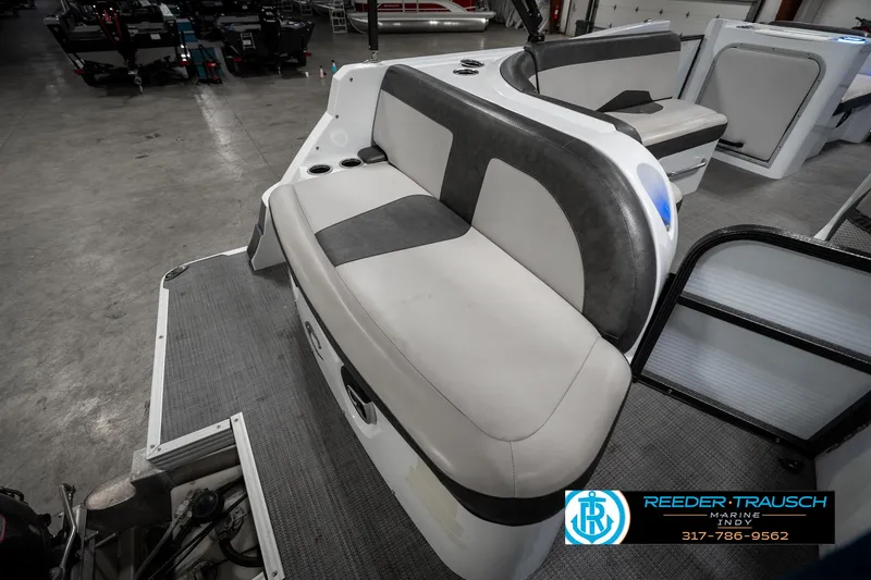 Slide: The Image of 2019 Crest Calypso 190 boat interior with gray seating in showroom. - 29