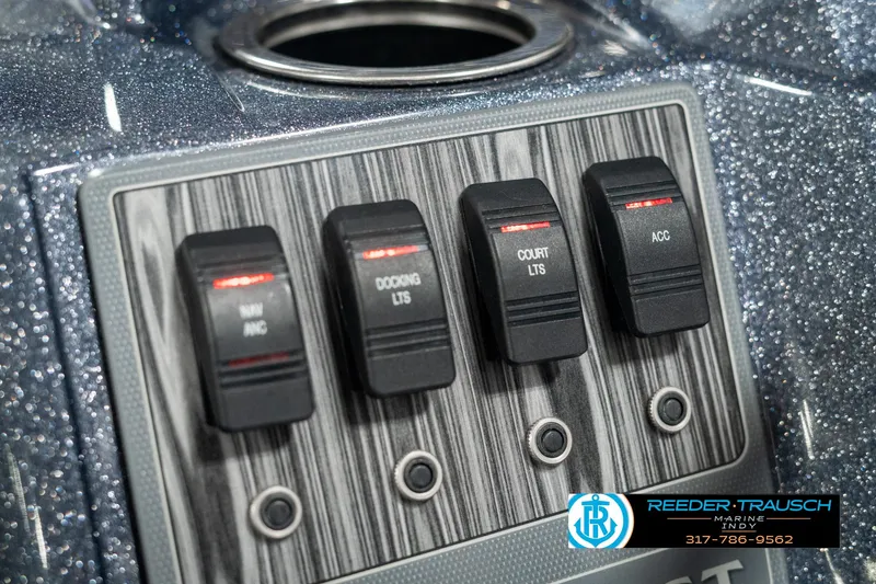 Slide: The Image of Control panel of 2019 Crest Calypso 190 boat with labeled switches. - 33