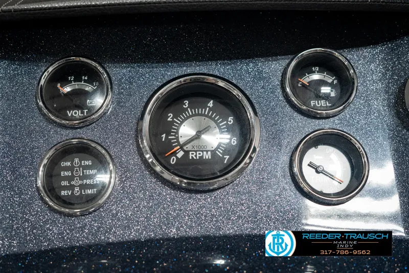 Slide: The Image of Dashboard of 2019 Crest Calypso 190 boat with RPM, volt, and fuel gauges. - 34