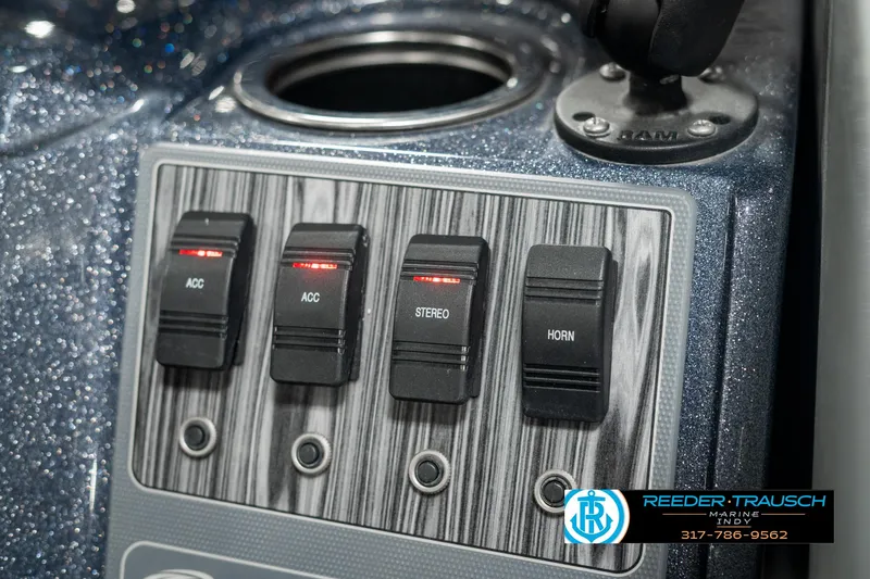 Slide: The Image of Control panel of 2019 Crest Calypso 190 boat with switches for accessories, stereo, and horn. - 36
