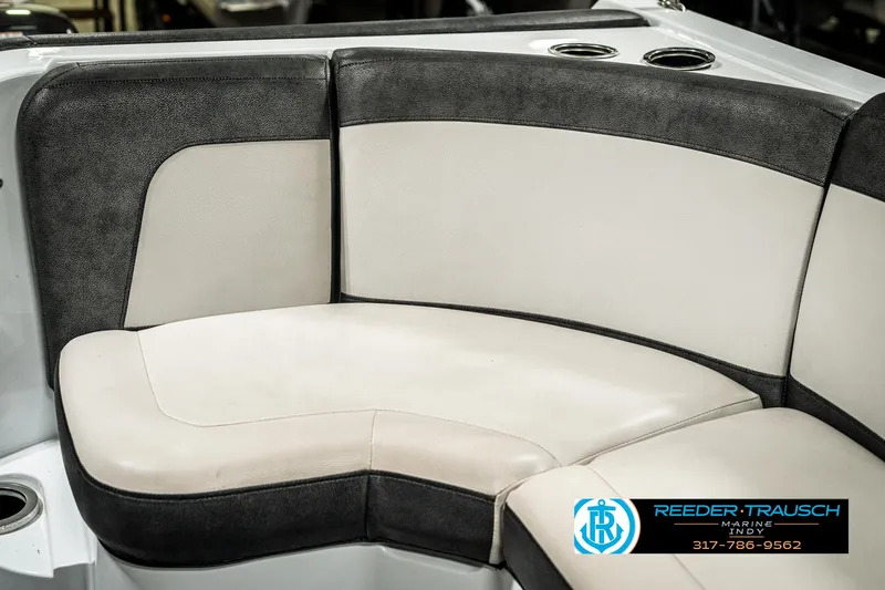 Slide: The Image of 2019 Crest Calypso 190 boat interior with cushioned seating and cup holders. - 39