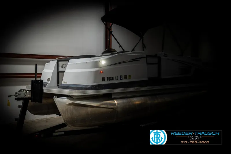 Slide: The Image of 2019 Crest Calypso 190 pontoon boat in storage, side view. - 4