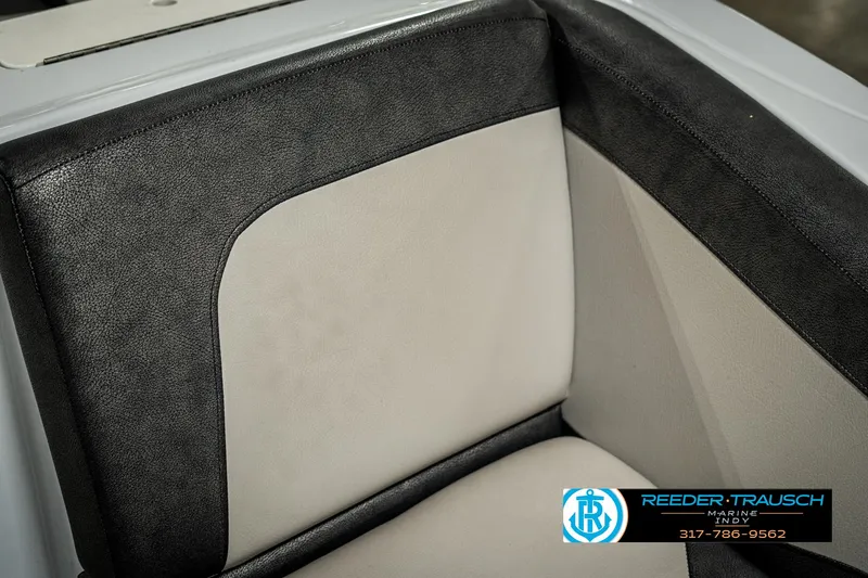 Slide: The Image of 2019 Crest Calypso 190 boat interior seating with black and beige upholstery. - 40
