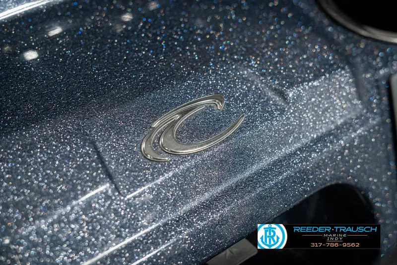 Slide: The Image of Close-up of 2019 Crest Calypso 190 boat logo with metallic finish. - 44