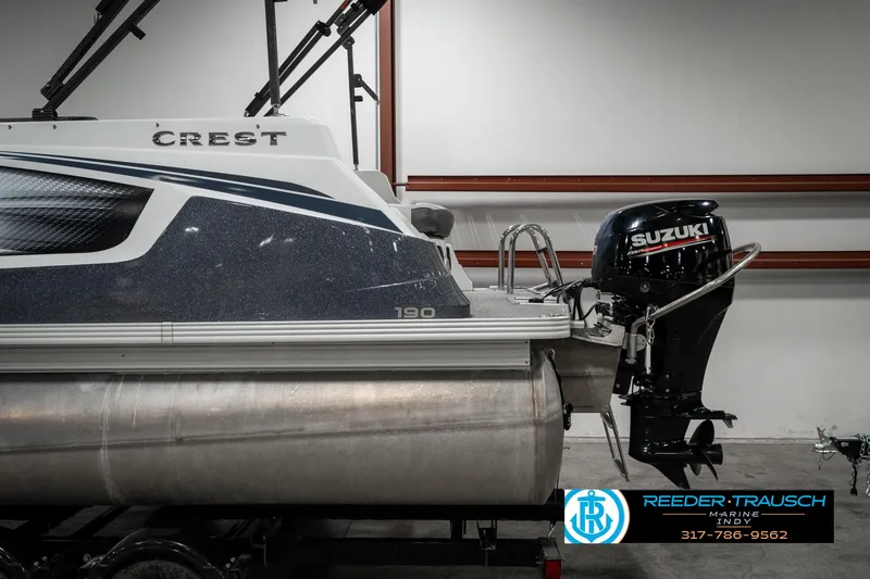 Slide: The Image of 2019 Crest Calypso 190 pontoon boat with Suzuki outboard motor in showroom. - 45