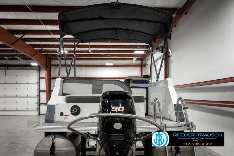 Slide: The Image of 2019 Crest Calypso 190 pontoon boat in indoor storage facility. - 7