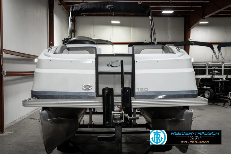 Slide: The Image of 2019 Crest Calypso 190 pontoon boat in indoor storage facility. - 8