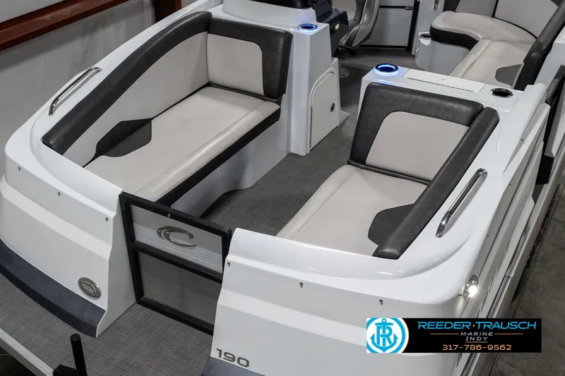 Slide: The Image of 2019 Crest Calypso 190 boat interior with gray and white seating. - 9