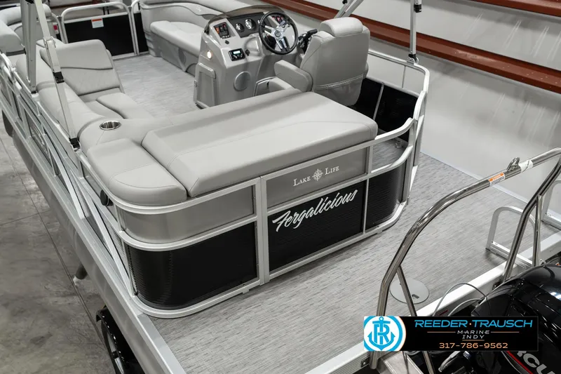 Slide: The Image of 2023 Bennington 20 SVL pontoon boat interior with seating and steering console. - 12