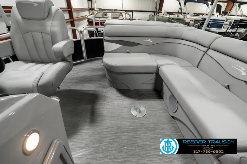 Slide: The Image of 2023 Bennington 20 SVL pontoon boat interior with gray seating and flooring. - 14