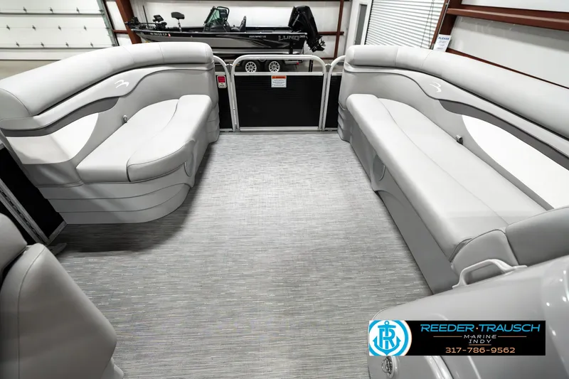 Slide: The Image of 2023 Bennington 20 SVL pontoon boat interior with gray seating and flooring. - 18
